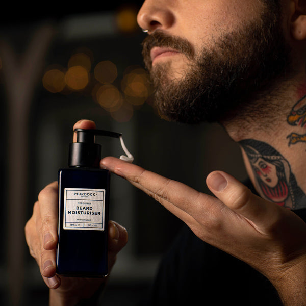 Beard Moisturiser 150ml held by barber close to their beard