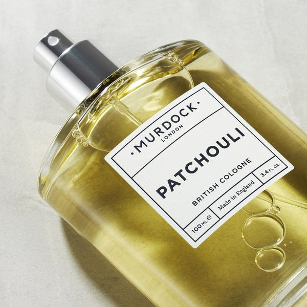 Patchouli Cologne with lid off laying flat