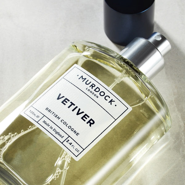 Vetiver Cologne laid flat with lid off to the side