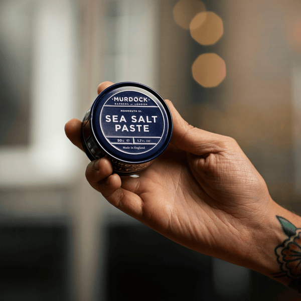 Sea Salt Paste held by a barber in our store