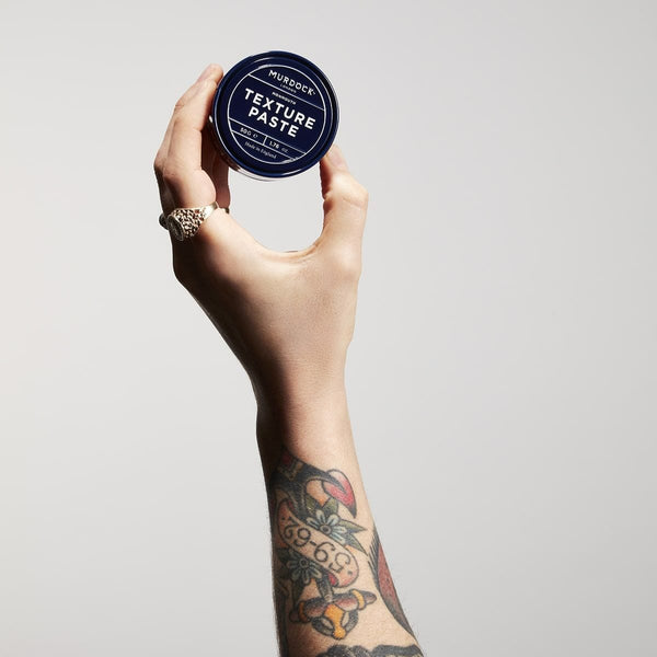 Texture Paste held by a barber