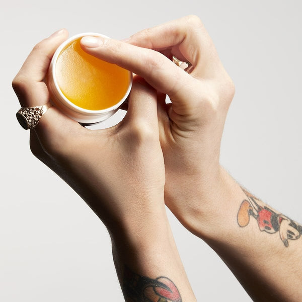 Vintage Pomade held by a barber whilst open