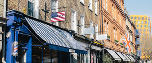 Murdock London storefront with a USA flag on the logo